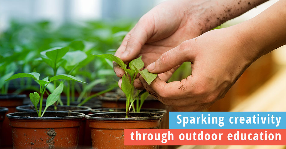Sparking creativity through outdoor education, photo of young child working with plants