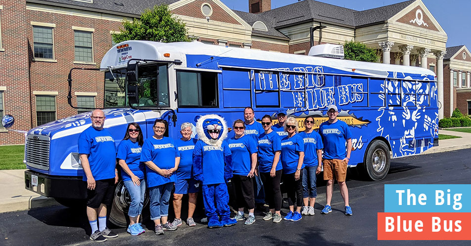 The Washington Court House team in front of The Big Blue Bus