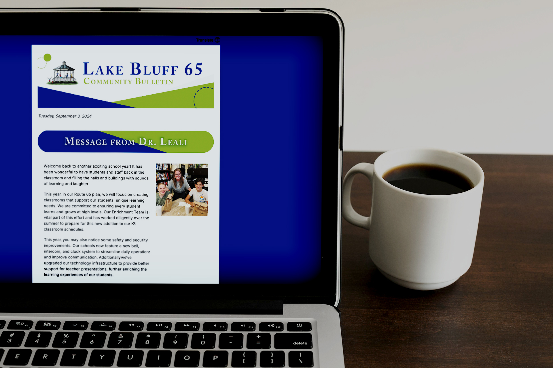 Email school newsletter open on a laptop next to a cup of coffee features student highlights as an example of Allerton Hill’s content creation for public school communications.